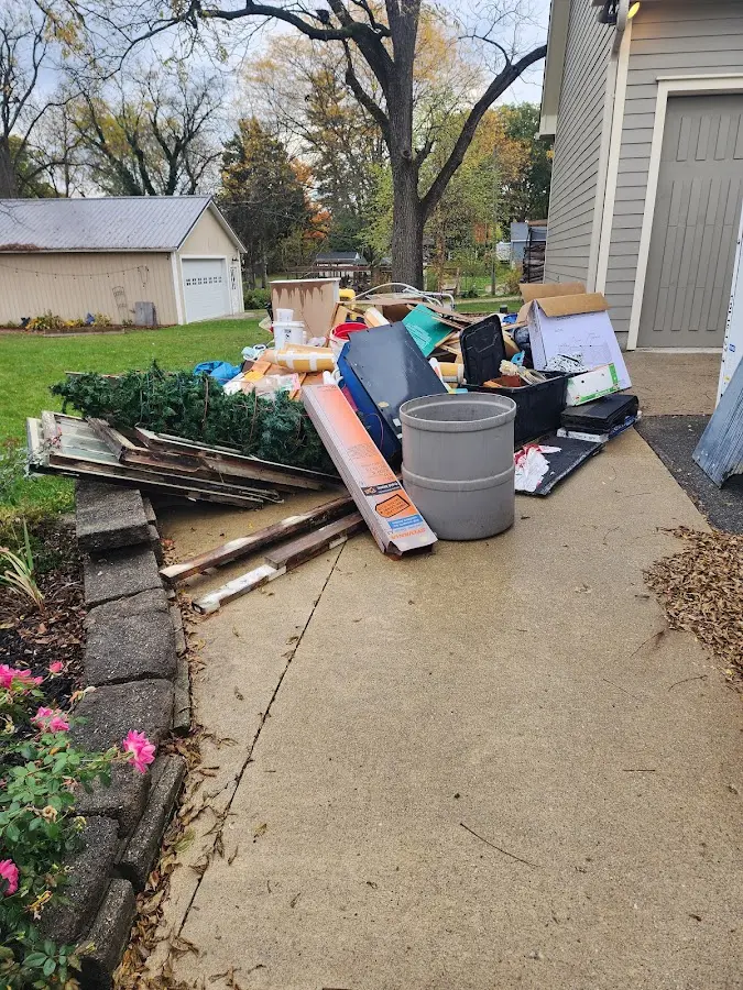 Dumpster being loaded with debris for Demolition Dumpster Rental in Farmersville